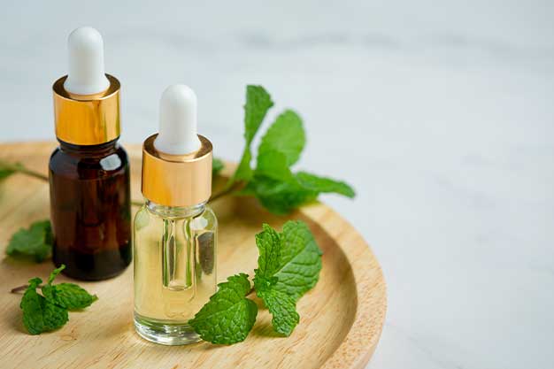 Best Essential Oils for Curly Hair - Benefits & DIY Recipes