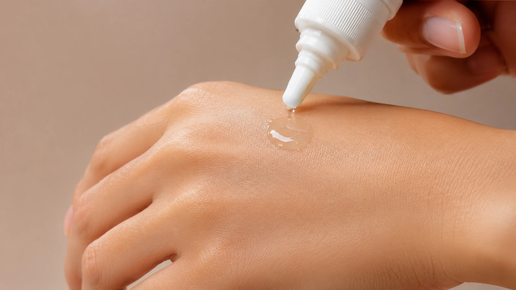 Jodveer oil being applied to the back of a hand
